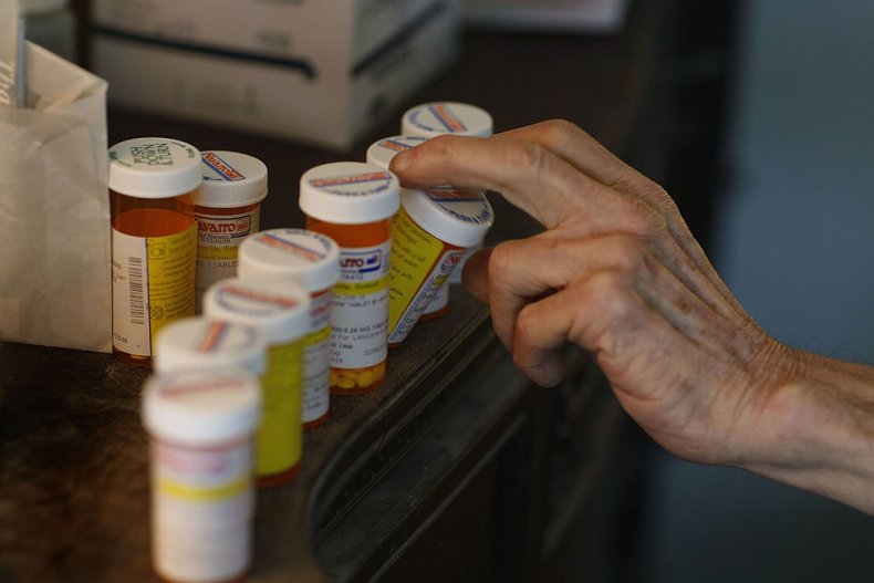 Person Grabbing Medication