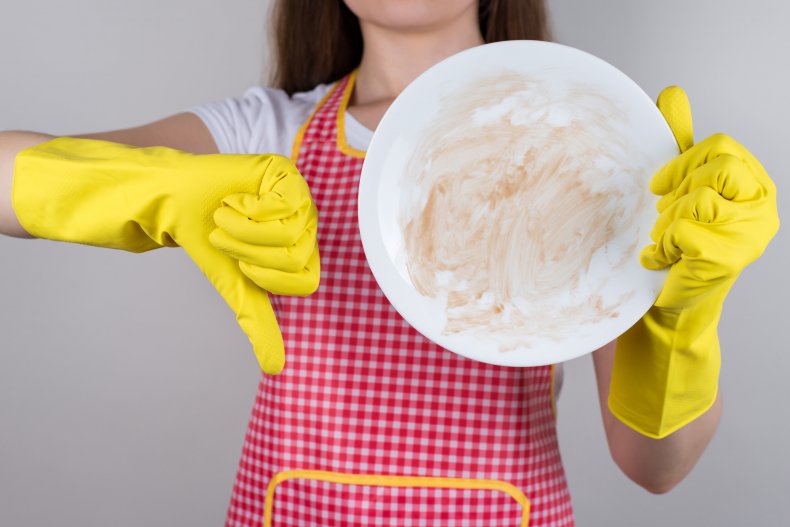 Woman washing a plate 