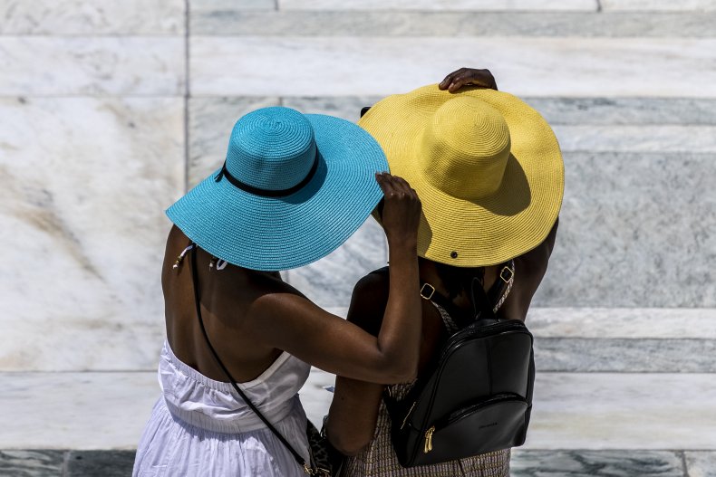 Two women pause for photo