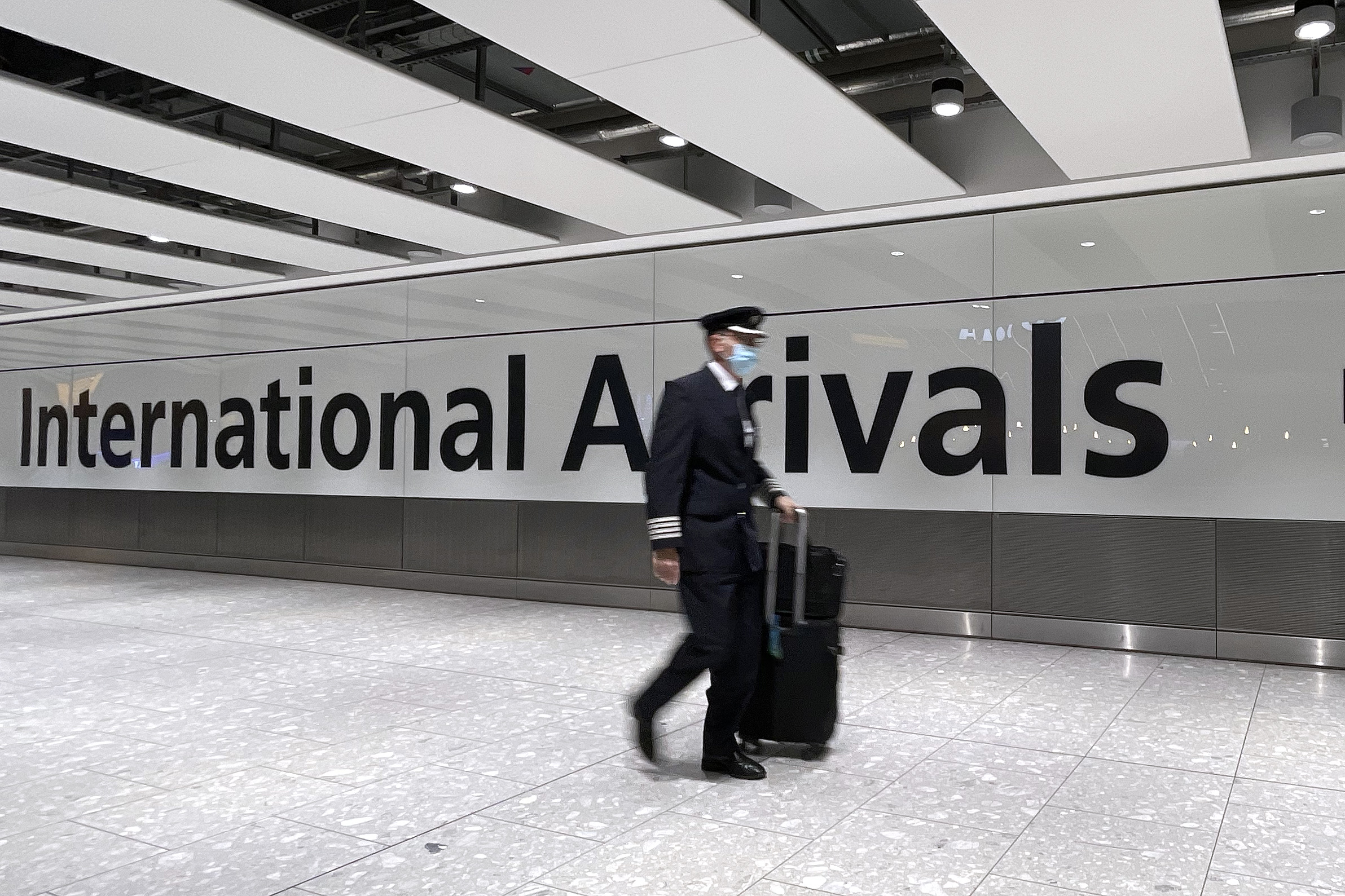 Omicron Found in 13 Air Passengers as Fauci Warns Variant May Elude Vaccines