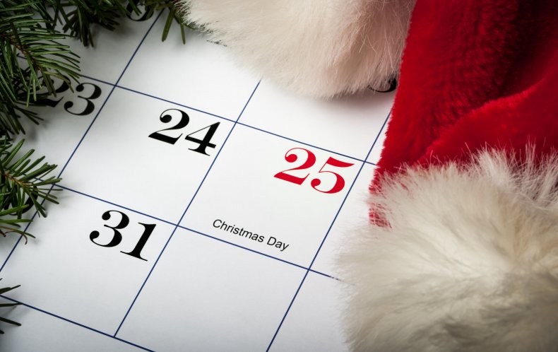 A Santa hat near a calendar. 