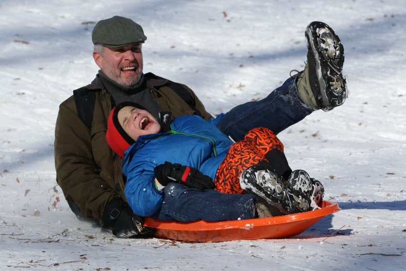 Father and son sledding