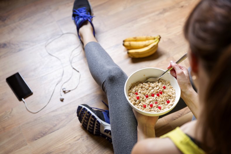 A woman having a bowl of oatmeal. 