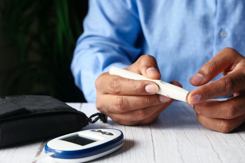 A diabetic person checking blood sugar levels.