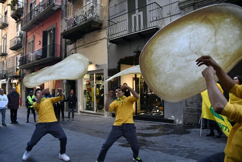 Italy's Pizzaioli Acrobats Coldiretti "twirling" pizza. 