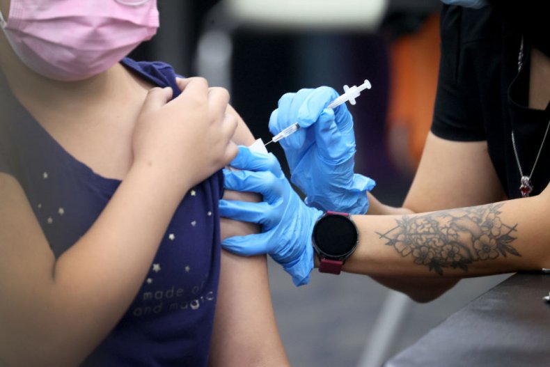 Child receiving a COVID-19 vaccine shot