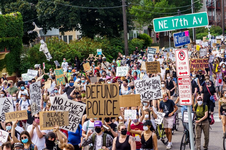 Demonstrators march against racism