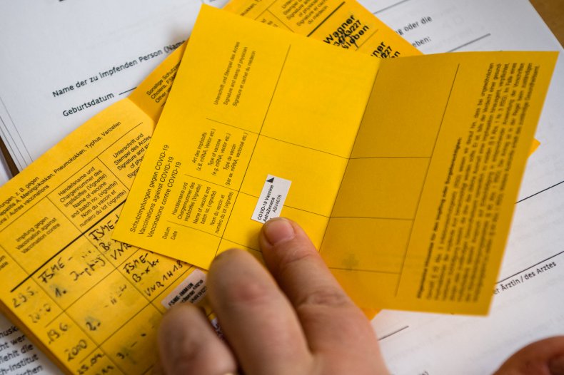A healthcare worker records vaccination