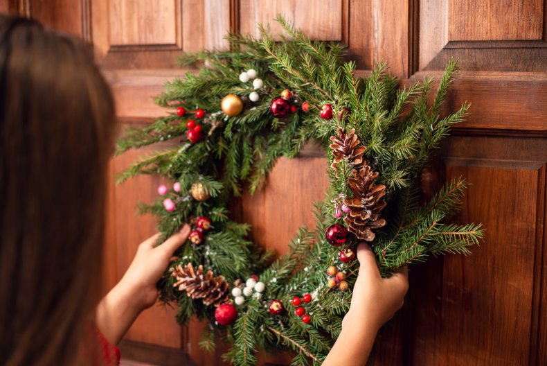 A Christmas wreath on a door.