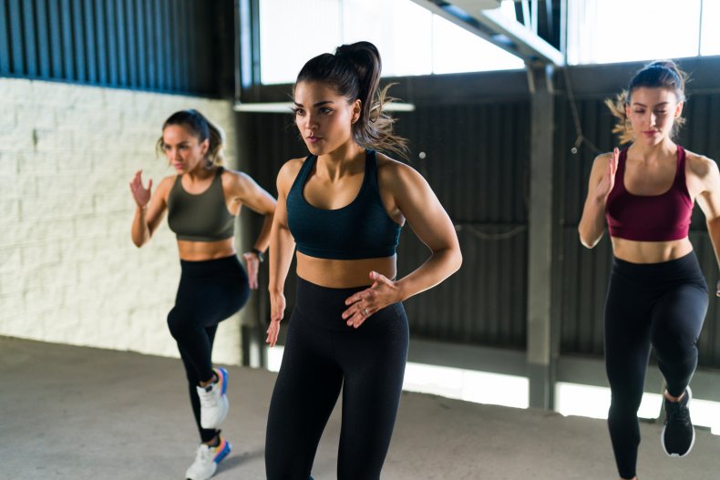 Women doing HIIT routine at the gym.