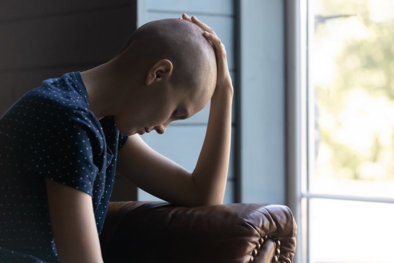 Woman with cancer in a hospital bed