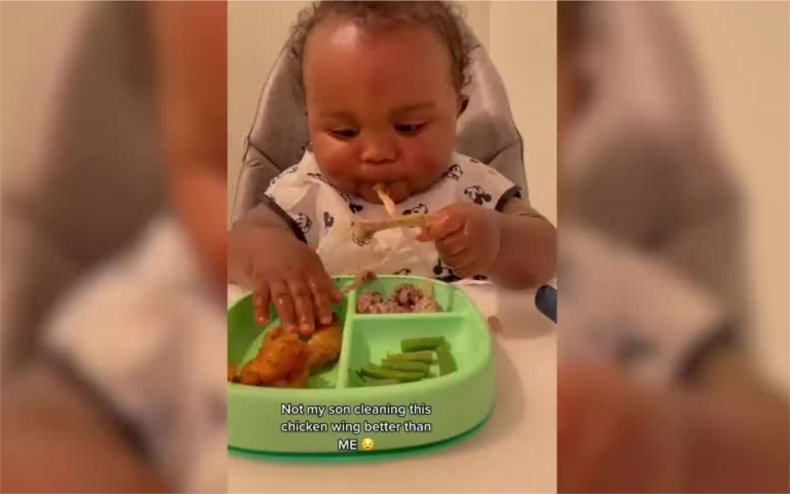 Isley, aged 1, eating chicken.