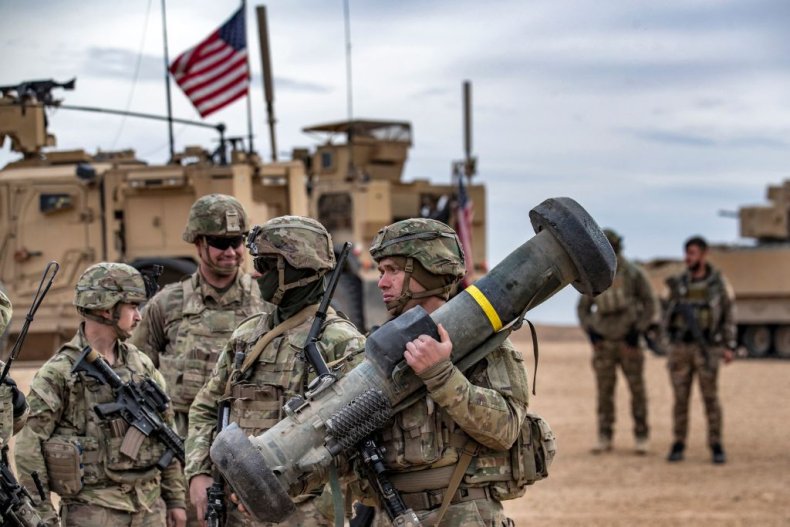 Soldier carries a javelin surface-to-air missile launcher