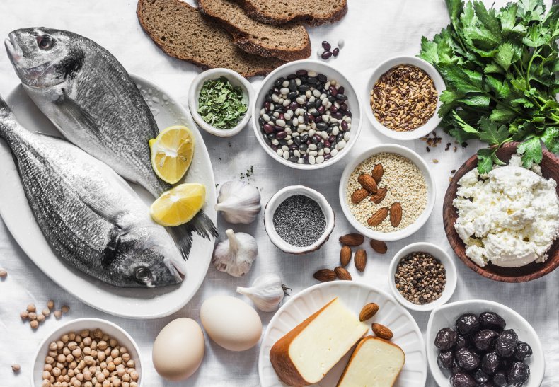 A spread of fish, nuts, beans, cheeses.