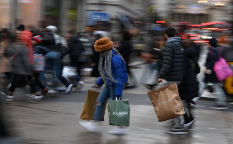 Shoppers carry their purchases