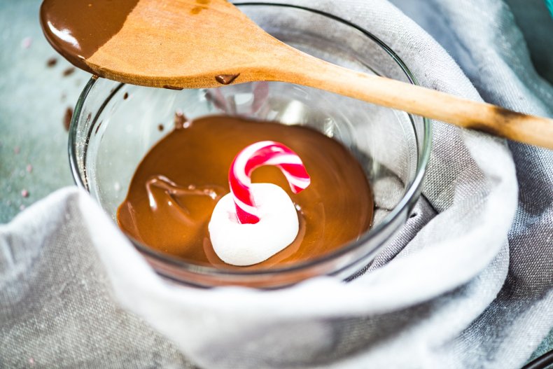 Marshmallow dipped in hot chocolate