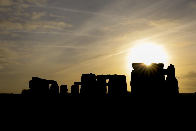 The sun rises over Stonehenge