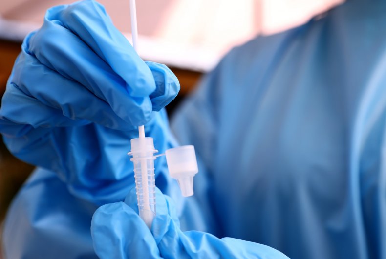Nurse with nasal swab test