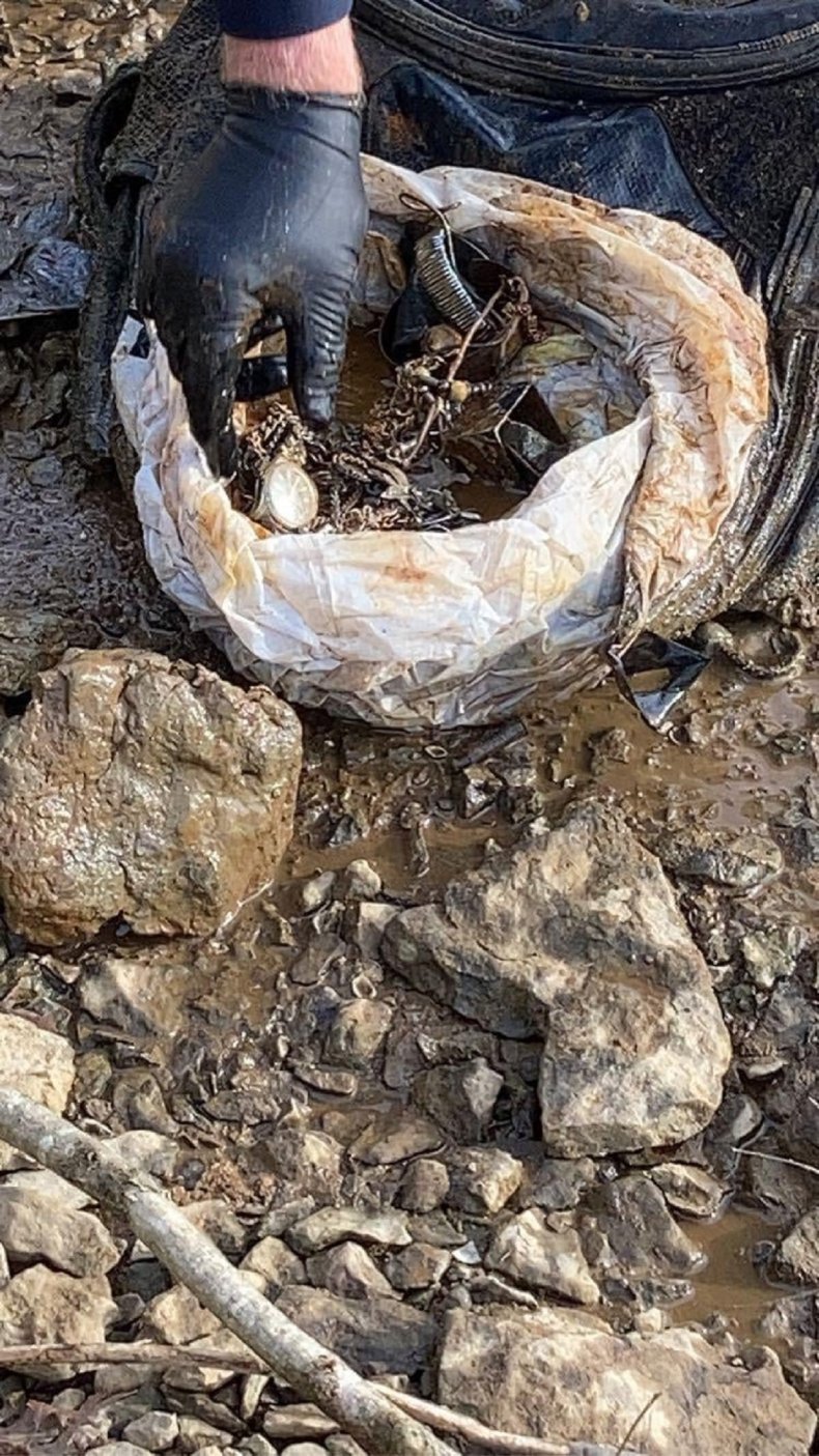 Weapon haul found in lake.