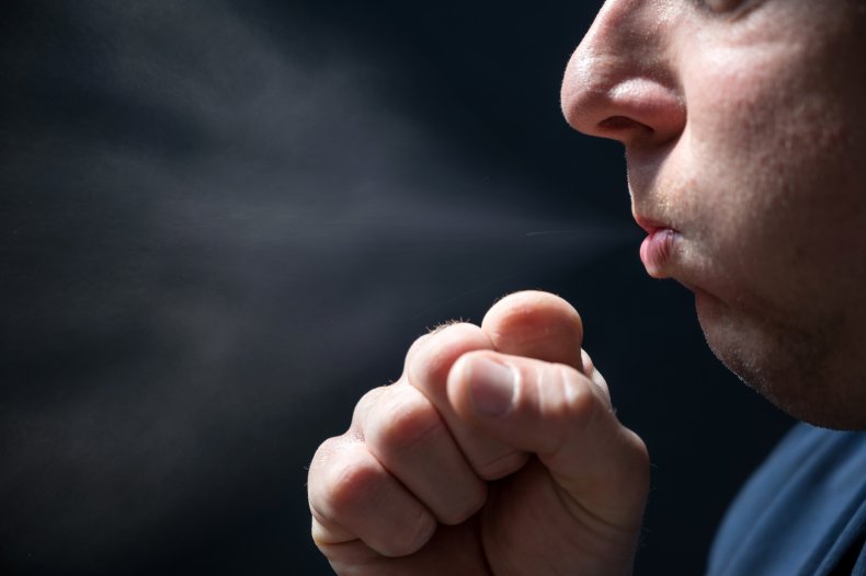 Stock image of man coughing