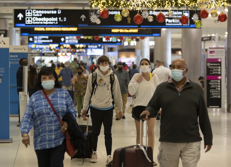 Travelers at Miami International Airport in 2021.