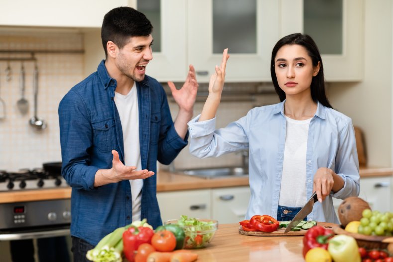 Couple arguing in kitchen