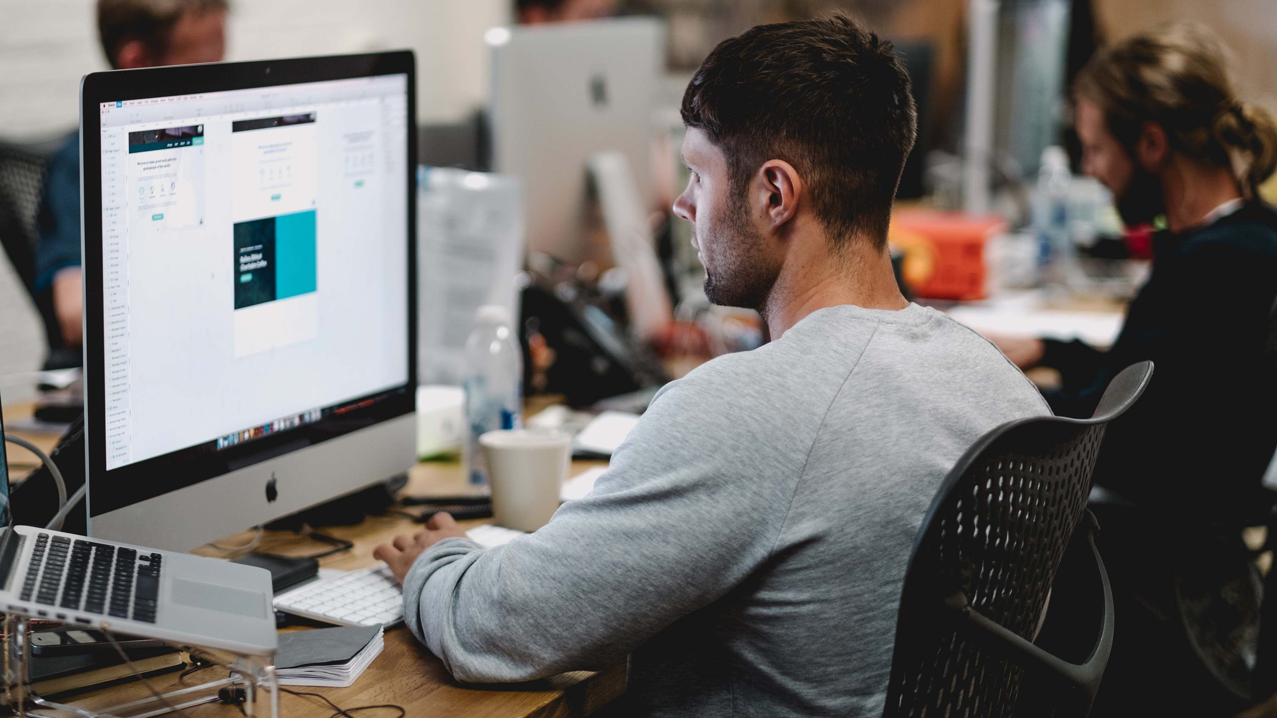 Man using iMac in the office