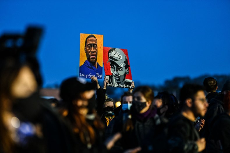 Demonstrators hold portraits during protest