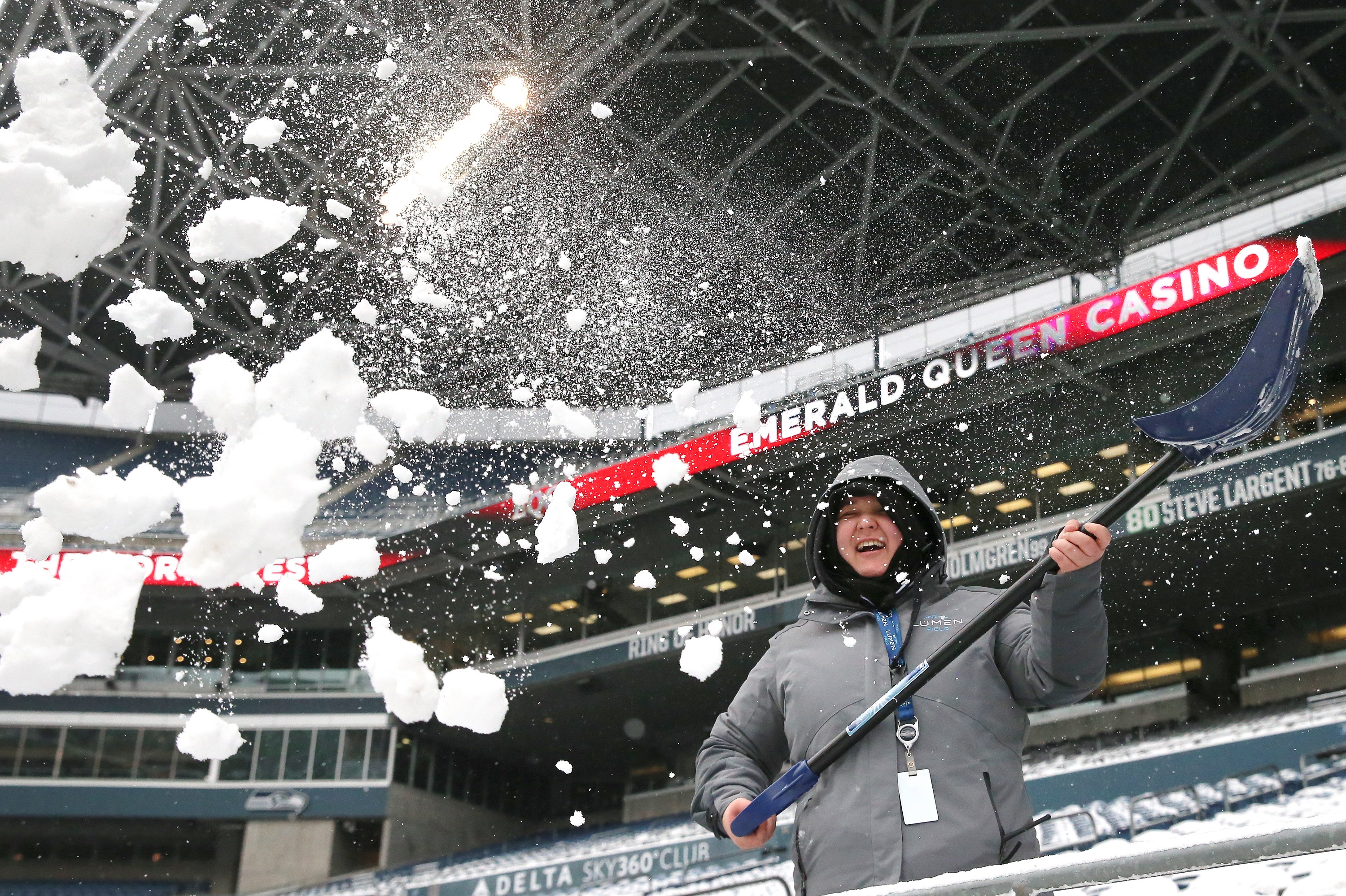 Snow is cleared at Seattle's Lumen Field ahead of Bears vs