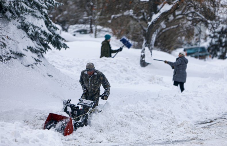 People digging out snow in Colorado.