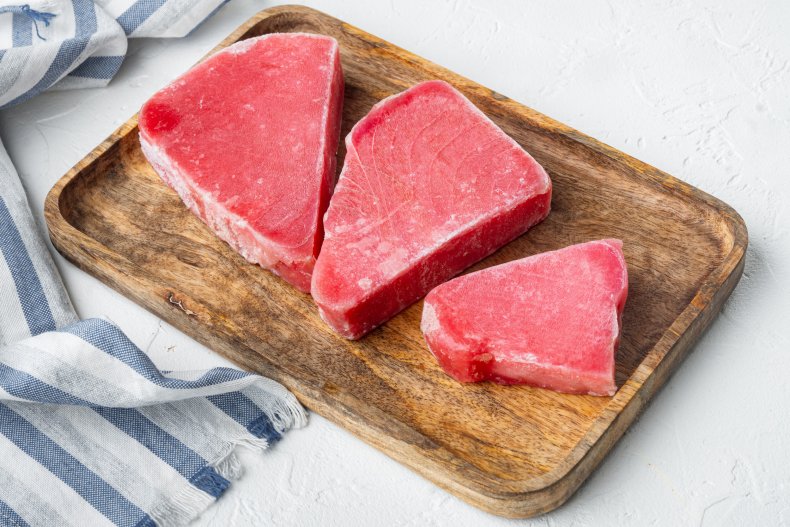 Raw frozen tuna fish steaks. 