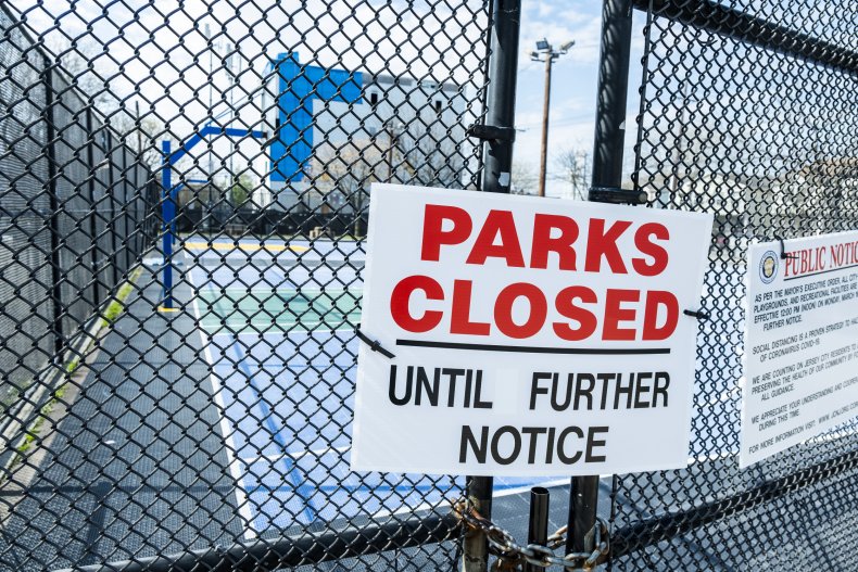 'Parks Closed' sign hangs on gate.
