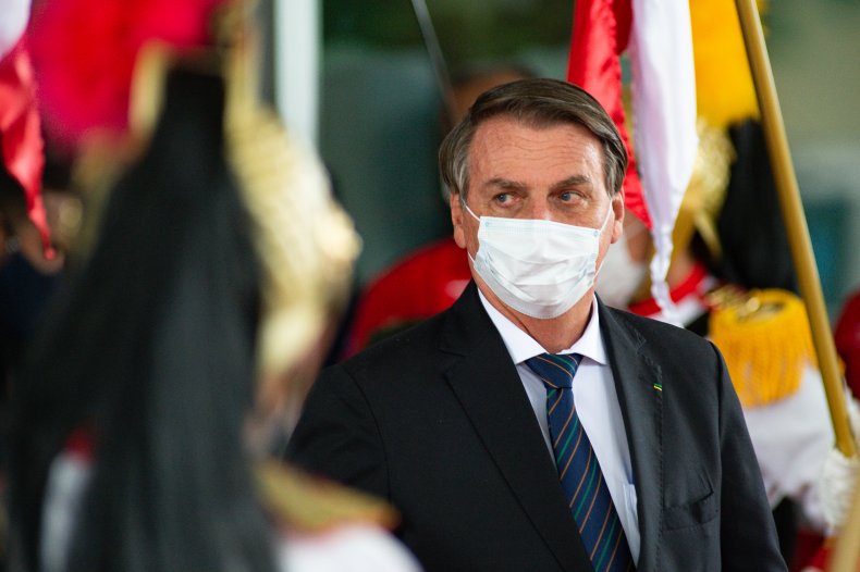 Brazilian President Jair Bolsonaro looks on