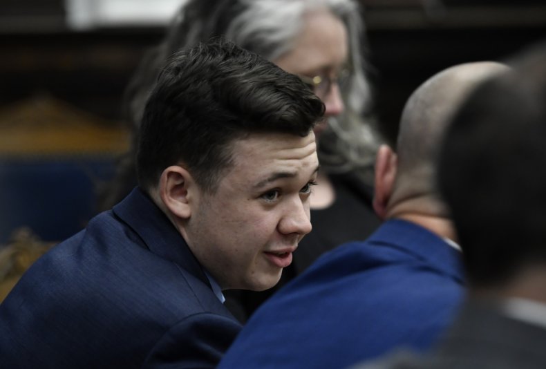 Kyle Rittenhouse talks to attorney at trial