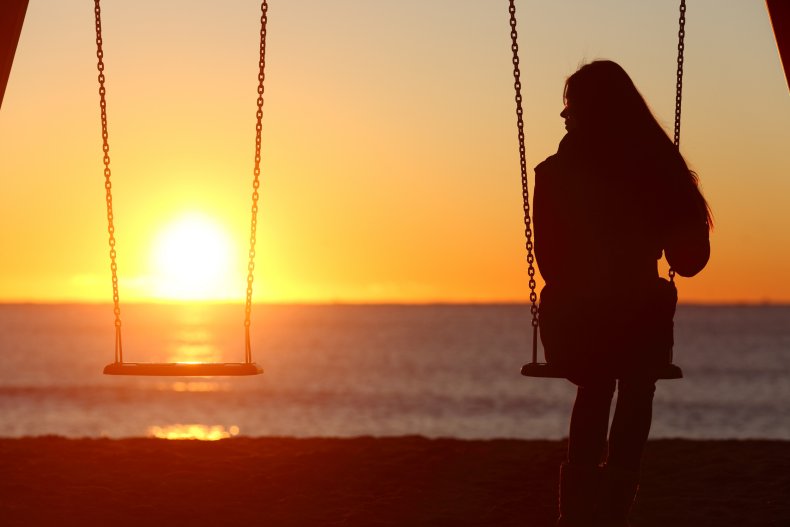 File photo of woman on swing.