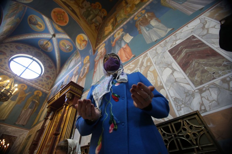 A worshipper at Epiphany in Jordan.