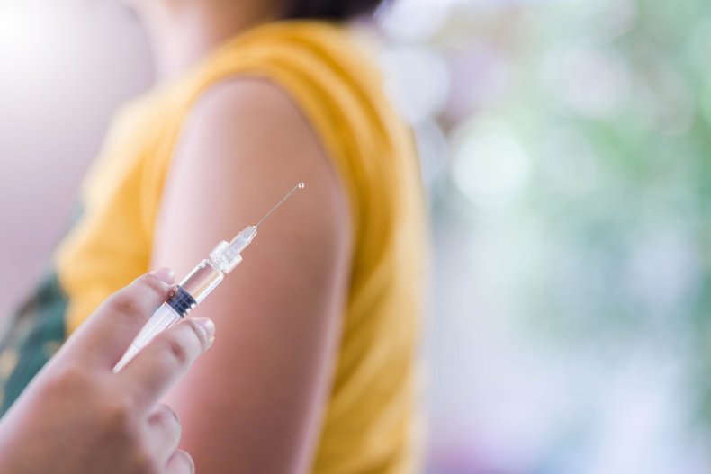 A woman getting vaccinated