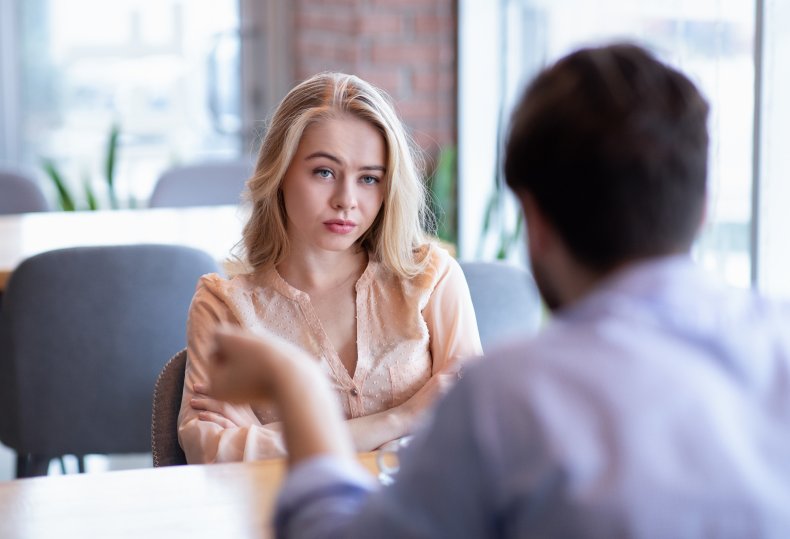 unimpressed woman at dinner
