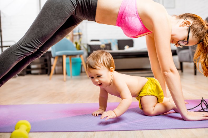 Woman exercising with baby