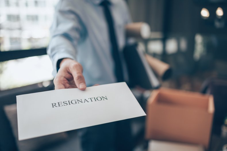 Businessman hands in resignation letter