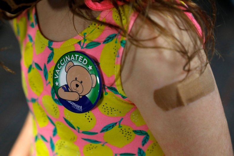 A child wears a pin 