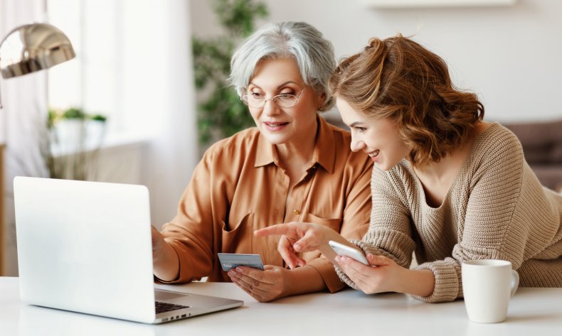 Mom and daughter looking at laptop