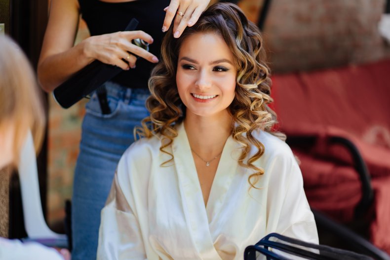 A bride having her hair done. 
