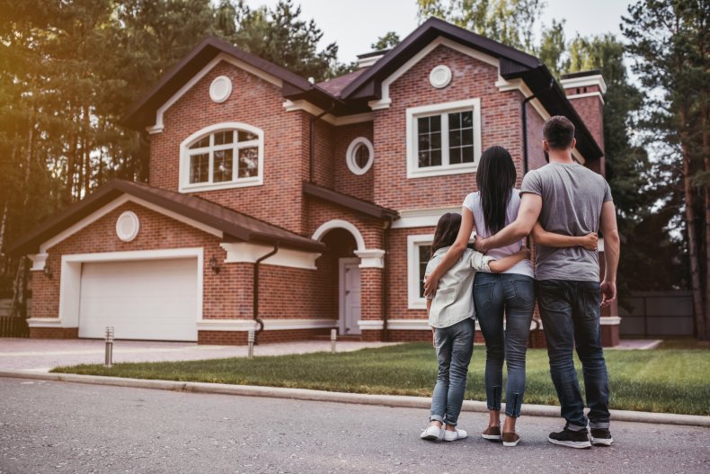 A family admiring their new home.