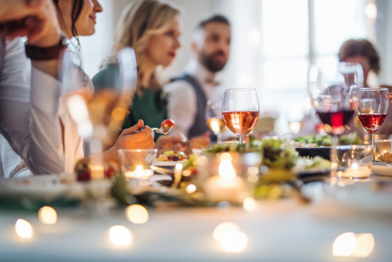 Guests eating a meal at a wedding.