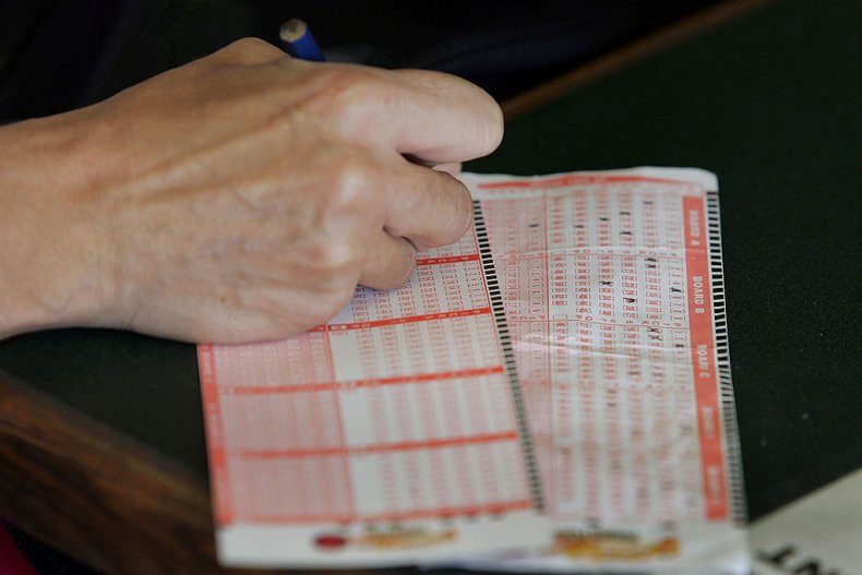 Person filling out lottery ticket