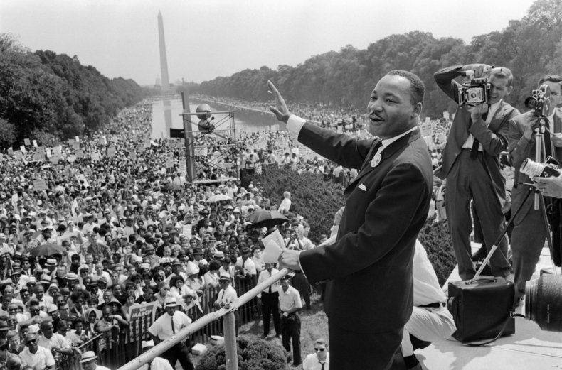  Martin Luther King Jr. waves to supporters 