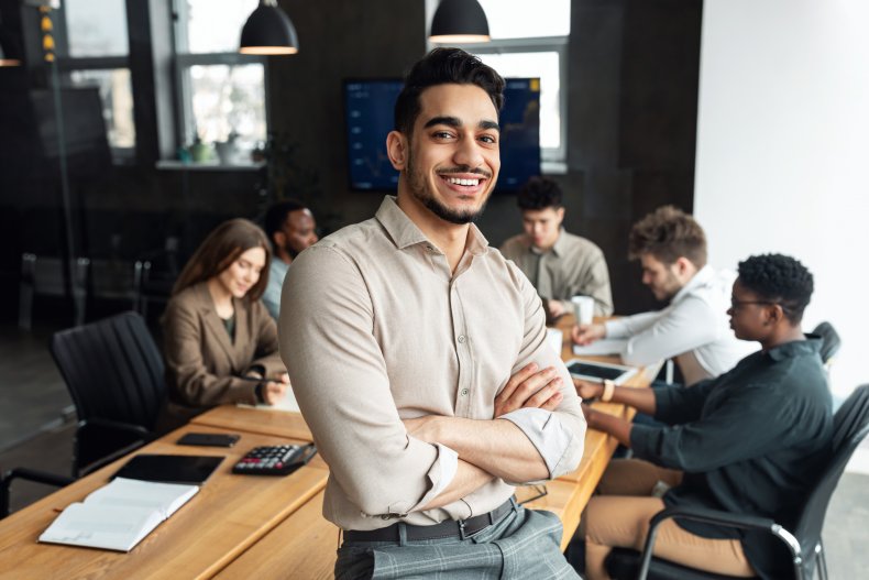 Employee sits on desk