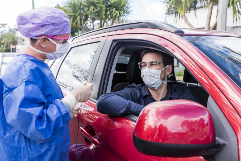 A doctor taking a nasal swab