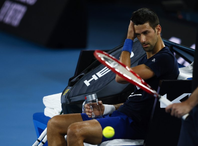 Novak Djokovic reacts on the tennis court